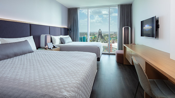 A two-bed room at Universal's Aventura Hotel, with a view of Volcano Bay water park.